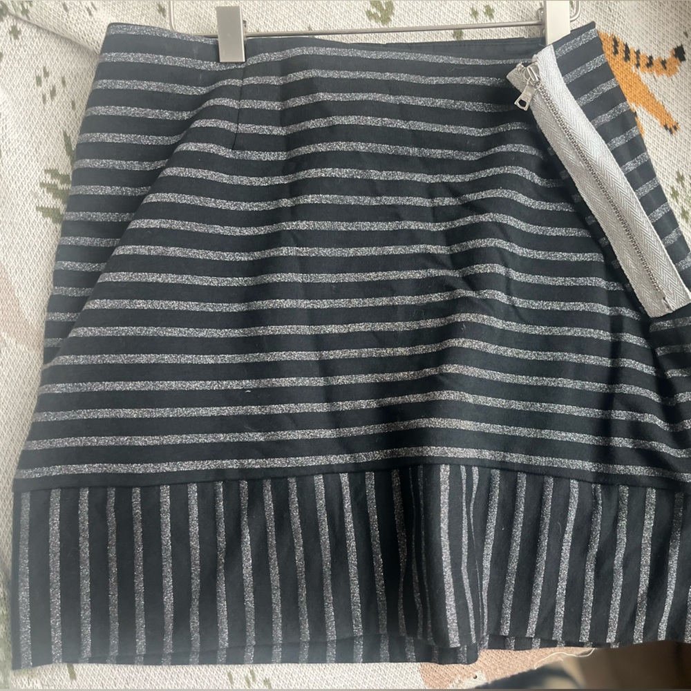 This is a black Trina Turk skirt with silver stripes